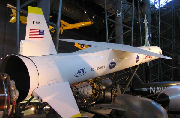 An Orbital Sciences Corporation Pegasus XL rocket is displayed in an area of the hangar that also hosts a variety of missiles. (credit: J. Foust)
